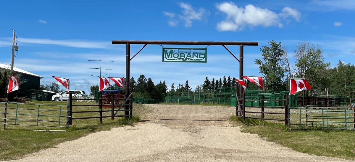 Large ranch gates adorned with Canadian flags